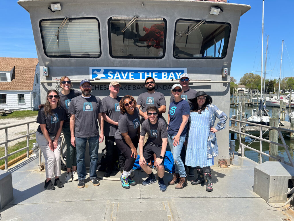 CallTrackingMetrics team in their volunteer shirts on the Bay. 